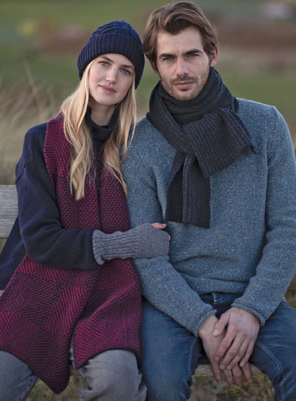 Couple wearing Fisherman Out of Ireland, wrapped in hat, scarf and gloves in the countryside